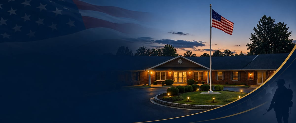 Illuminated house at dusk with American flag on a flagpole, lit landscape, and patriotic atmosphere